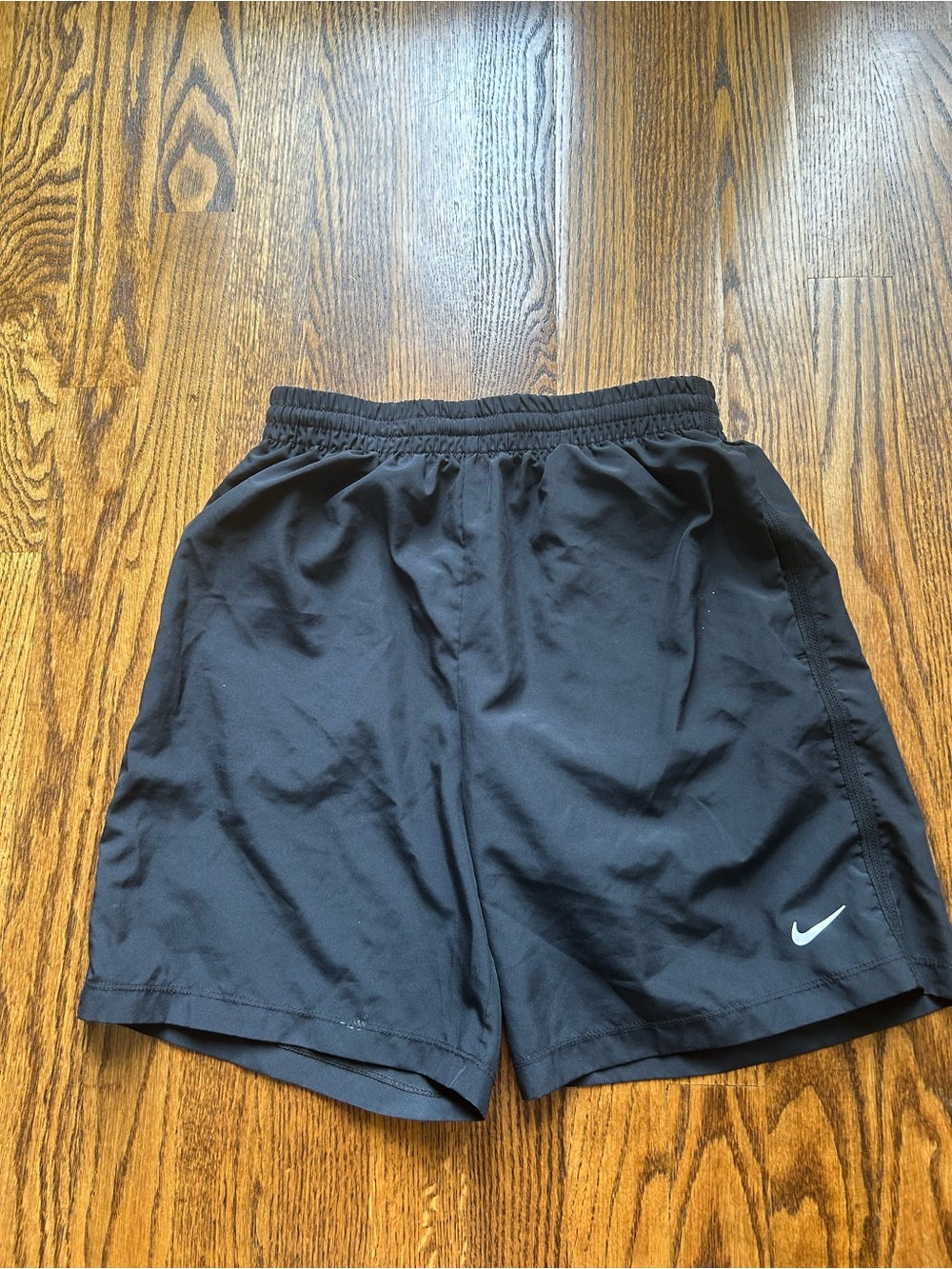 Kids Nike Black Athletic Shorts with White Swoosh